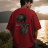 1A Oversized streetwear T-shirt featuring Too Much Inside Emotional Graphic Tee India typography on the front and artistic heart graphic print on the back, photographed in a scenic sunset outdoor location.