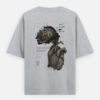 Oversized streetwear T-shirt featuring Too Much Inside Emotional Graphic Tee India typography on the front and artistic heart graphic print on the back, photographed in a scenic sunset outdoor location.