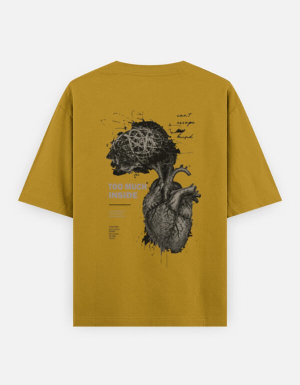 Oversized streetwear T-shirt featuring Too Much Inside Emotional Graphic Tee India typography on the front and artistic heart graphic print on the back, photographed in a scenic sunset outdoor location.