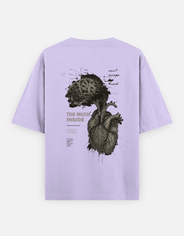 Oversized streetwear T-shirt featuring Too Much Inside Emotional Graphic Tee India typography on the front and artistic heart graphic print on the back, photographed in a scenic sunset outdoor location.