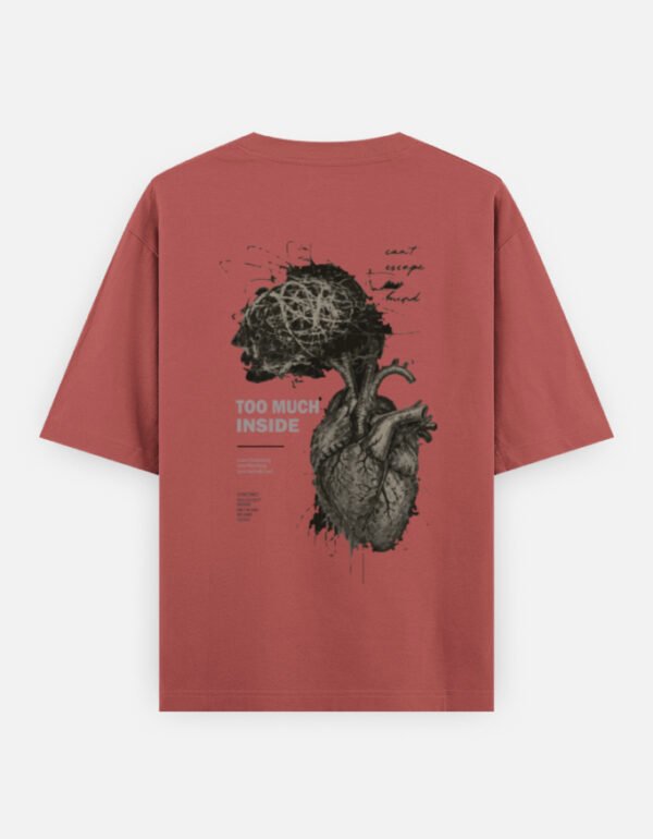 Oversized streetwear T-shirt featuring Too Much Inside Emotional Graphic Tee India typography on the front and artistic heart graphic print on the back, photographed in a scenic sunset outdoor location.