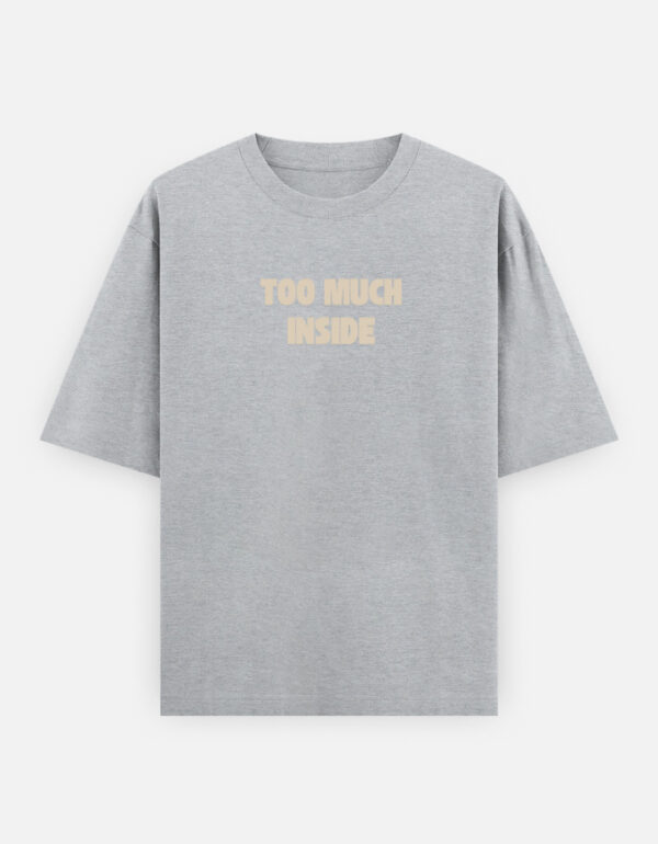 default Oversized streetwear T-shirt featuring Too Much Inside Emotional Graphic Tee India typography on the front and artistic heart graphic print on the back, photographed in a scenic sunset outdoor location.